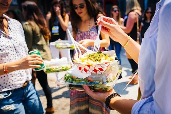 People enjoying a food truck meal